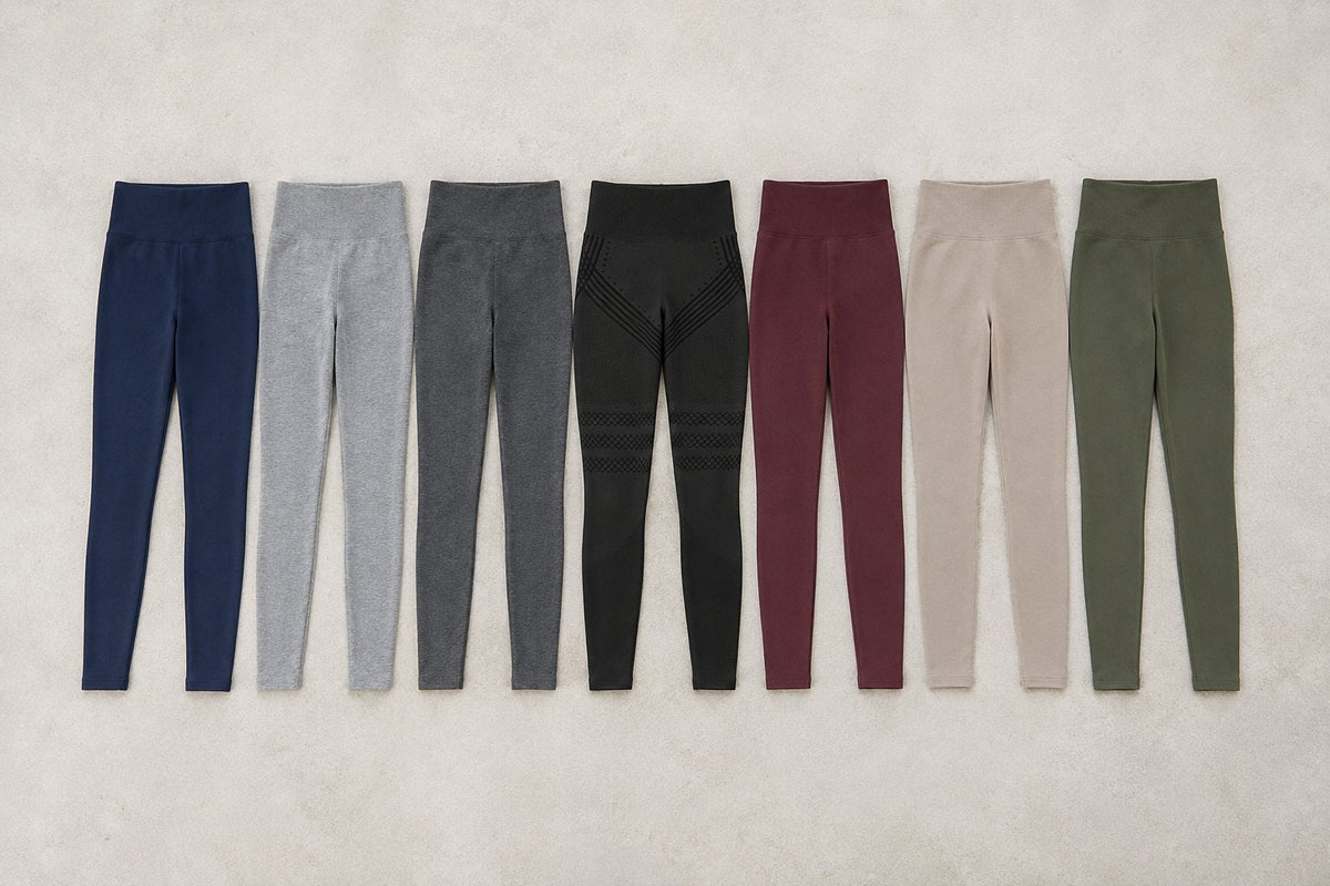 Seven pairs of leggings laid out for comparison, with black Sculpt 3D leggings in the centre.