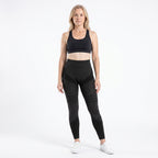 Woman in her fifties wearing the black high-waisted 3D legging, front view