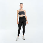 Black 3D legging worn with a gray sports bra and white sneakers, full front view