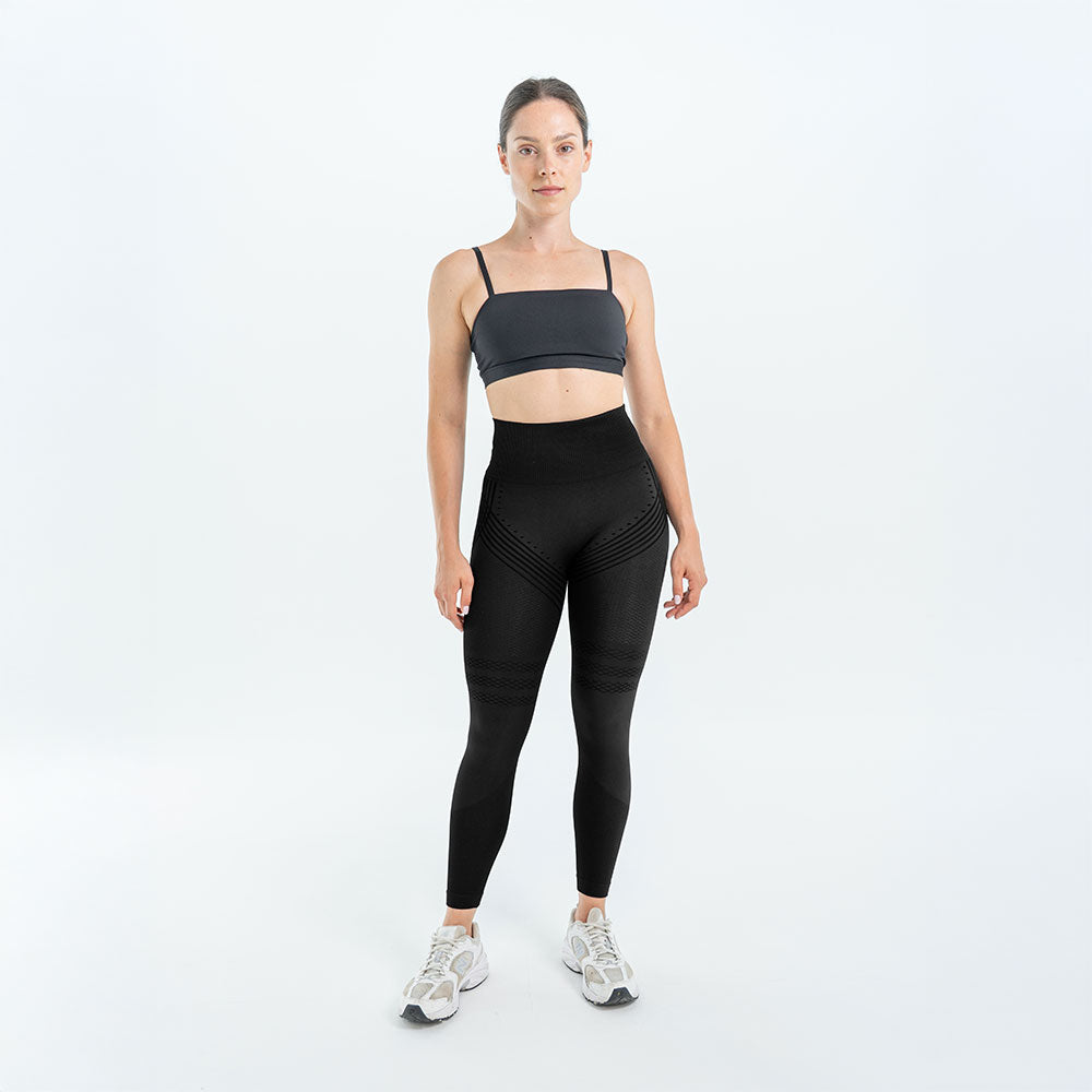 Black 3D legging worn with a gray sports bra and white sneakers, full front view