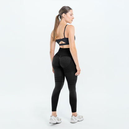 Black 3D legging worn with a gray sports bra and white sneakers, full back view