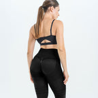 Back view of the black 3D legging cropped at mid-thigh, ruched knit across the seat