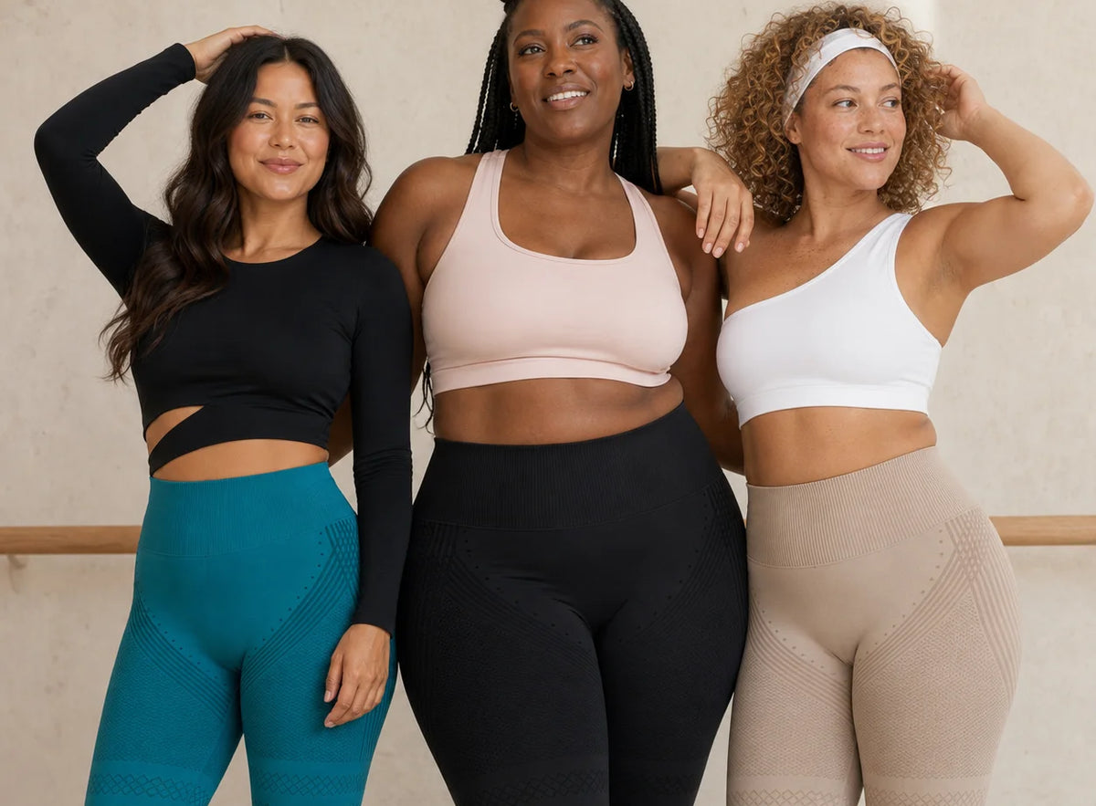 Three women wearing leggings and sports tops