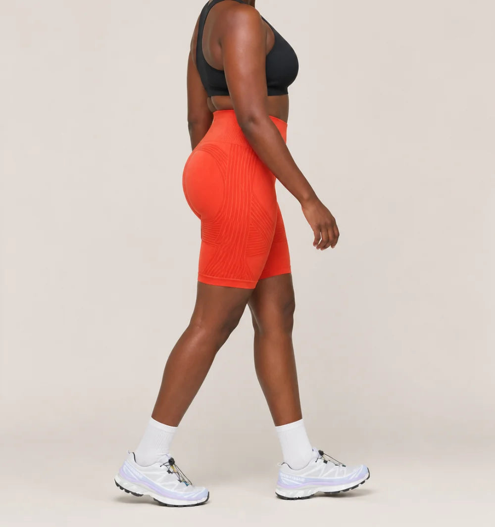3D Shorts in Orange, side view of the seamless knit with raised 3D panels